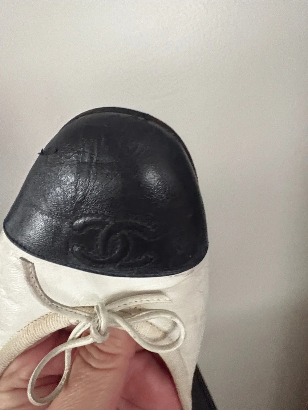 CHANEL White Leather Ballet Flats with Black Cap Toe and Bow